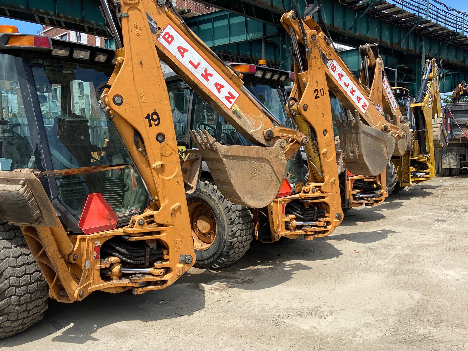 Balkan has a full fleet of backhoes for water main repair work