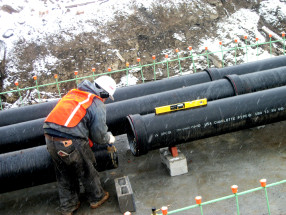 Carefully checking each piece of pipe