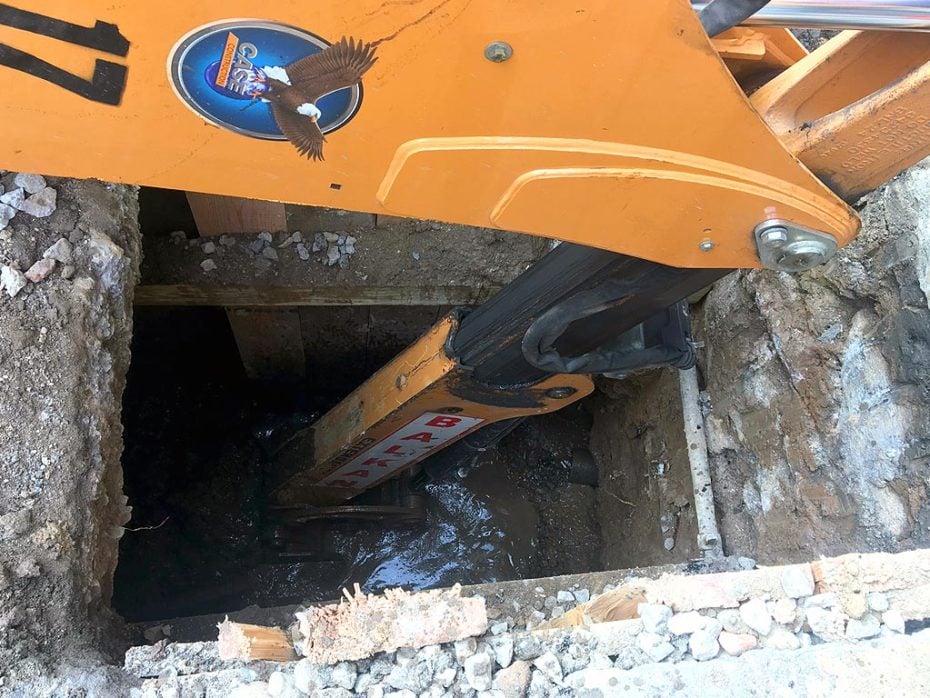 Emergency Sewer Repairs Backhoe In Action