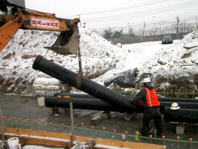 laying sewer pipe