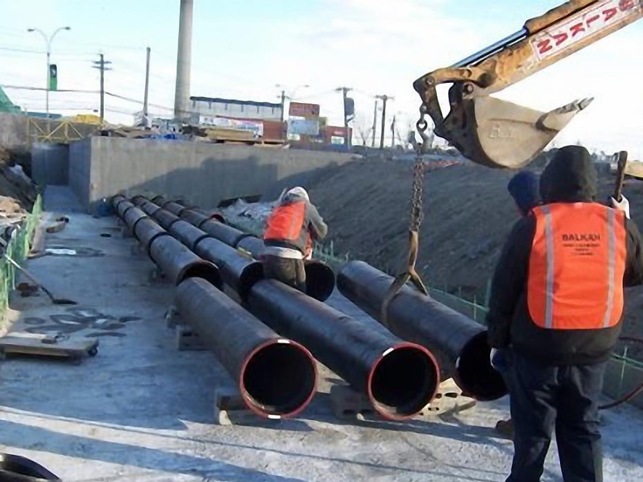 house sewer lines being installed with pitch on a sewer line for each of three sewers