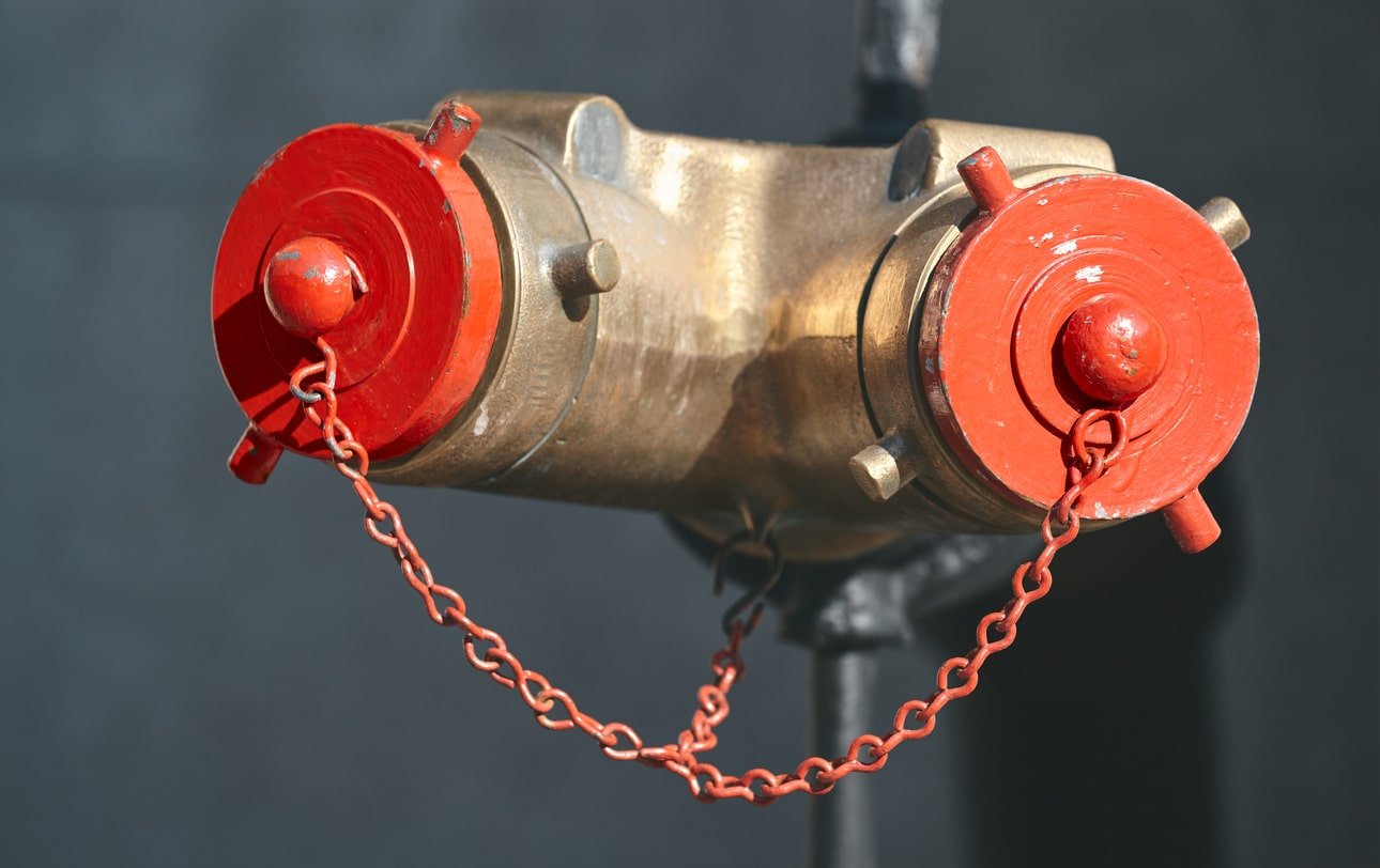 A standpipe of a property building showing a Siamese connection.