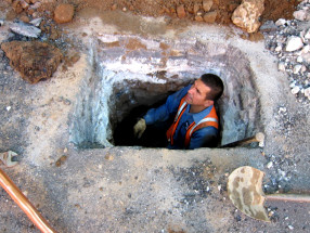 worker inside hole